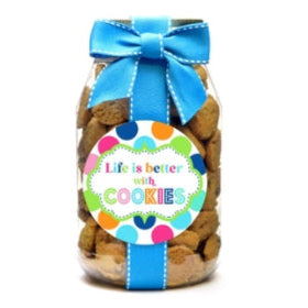 Jar of cookies with a colorful label and blue bow on a white background