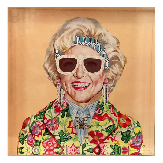 A square portrait painting of an elderly woman with blonde hair, white sunglasses, a blue beaded headband, and a colorful floral jacket, set against a warm tan background.