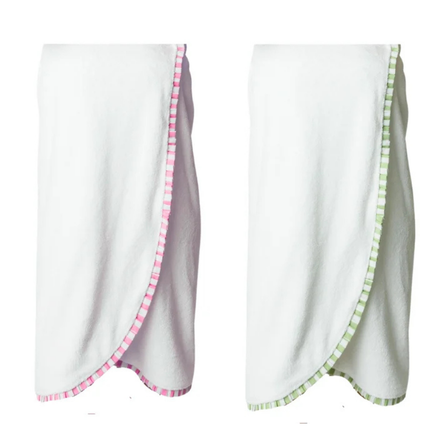 Two white baby wraps or swaddle blankets with gingham trim, shown side by side on a plain white background. The left wrap has pink trim, and the right wrap has green trim.