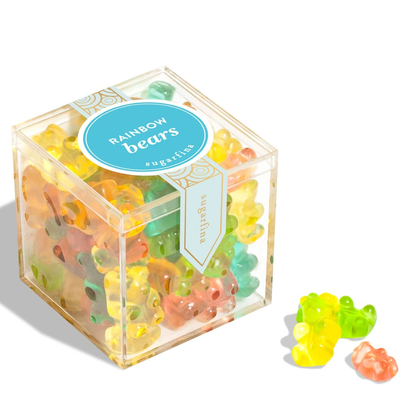 Box of colorful gummy bears with a clear lid on a white background